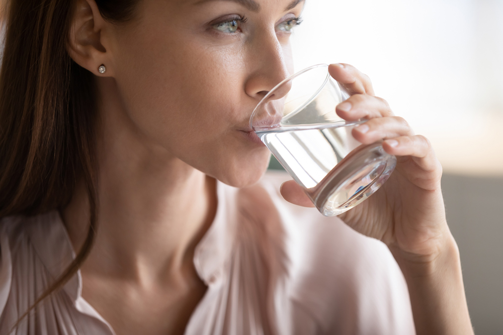 Woman drinking hydrogen water