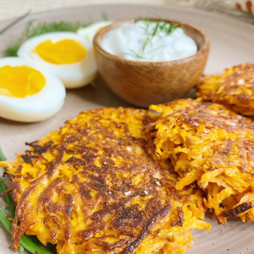 Saladmaster prepared hashbrowns, shown as hashbrown patties with eggs and yogurt dip