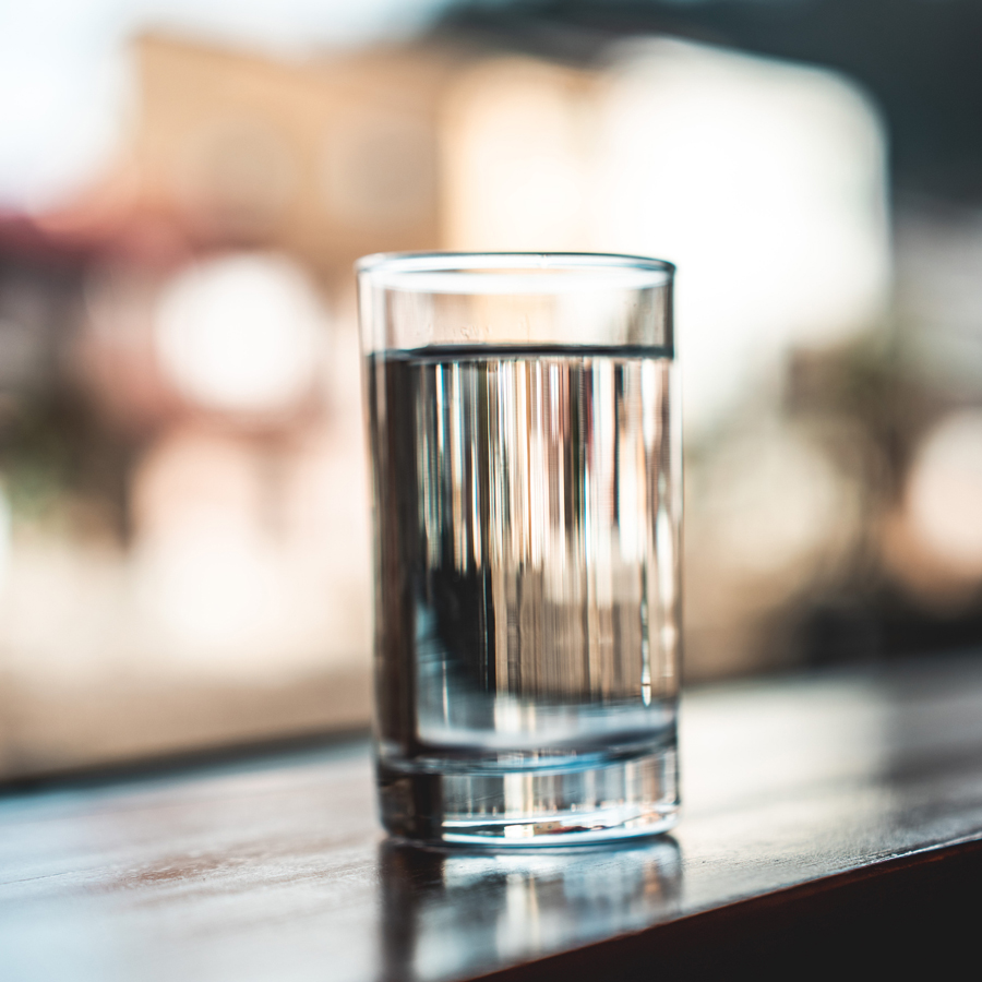 Glass of clean hydrogen generated water on countertop